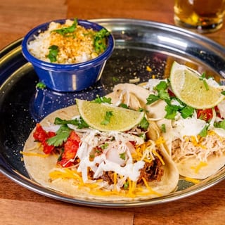 2 Gourmet Tacos with rice & refried beans